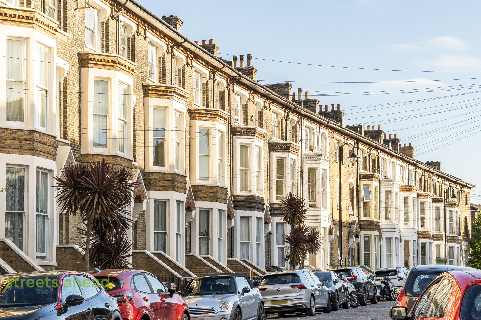 Bay-fronted Victorian terraced houses on a residential street in Crystal Palace