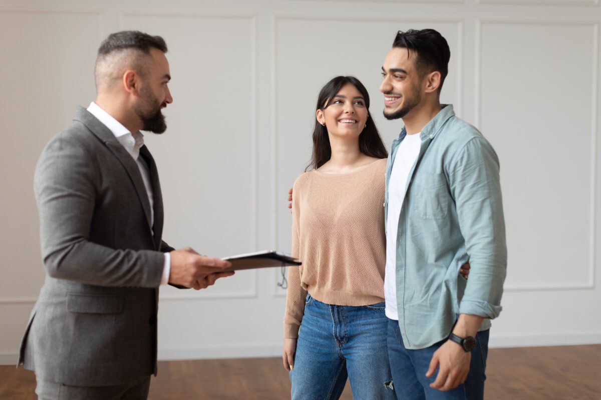 Estate Agent Showing Property For Young Buyers sell